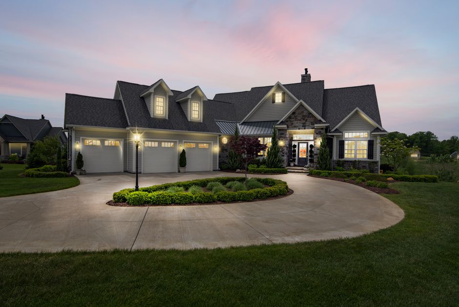 Upscale home exterior lit at dusk