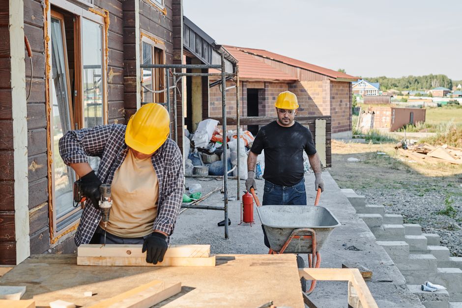 Construction crew building a house frame